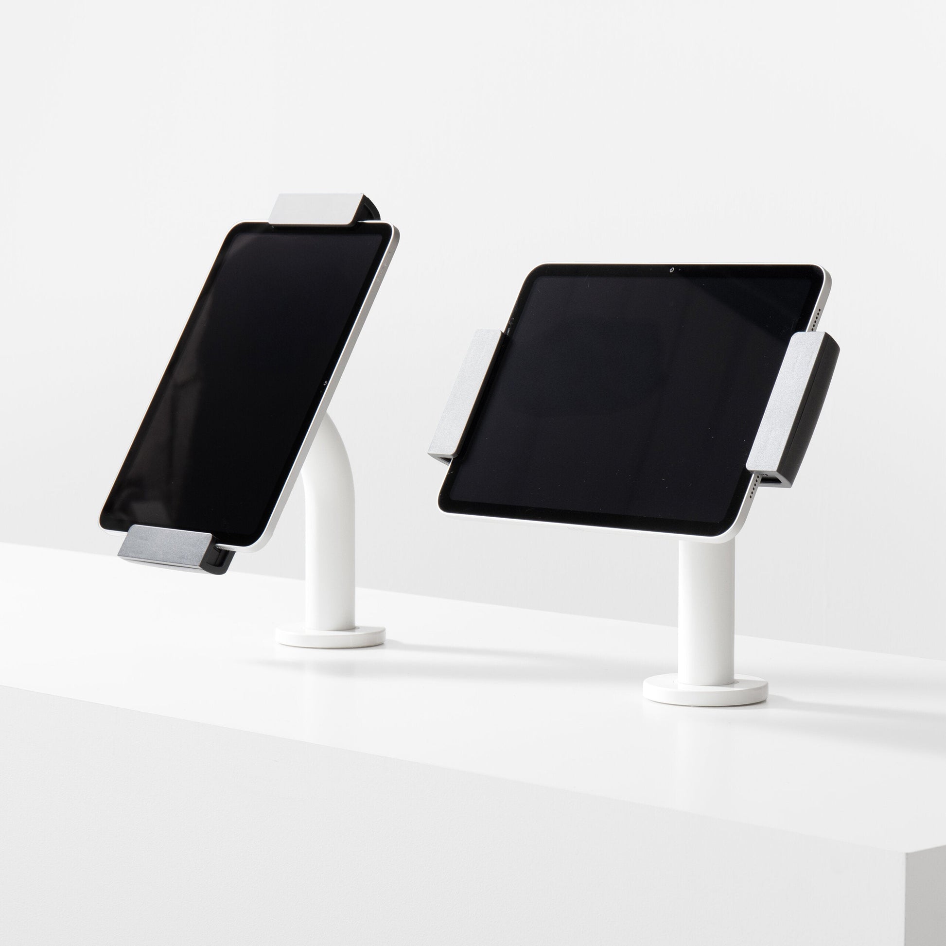 Bouncepad Clip Static 60 Tablet Desk Mount in white, portrait and landscape orientation