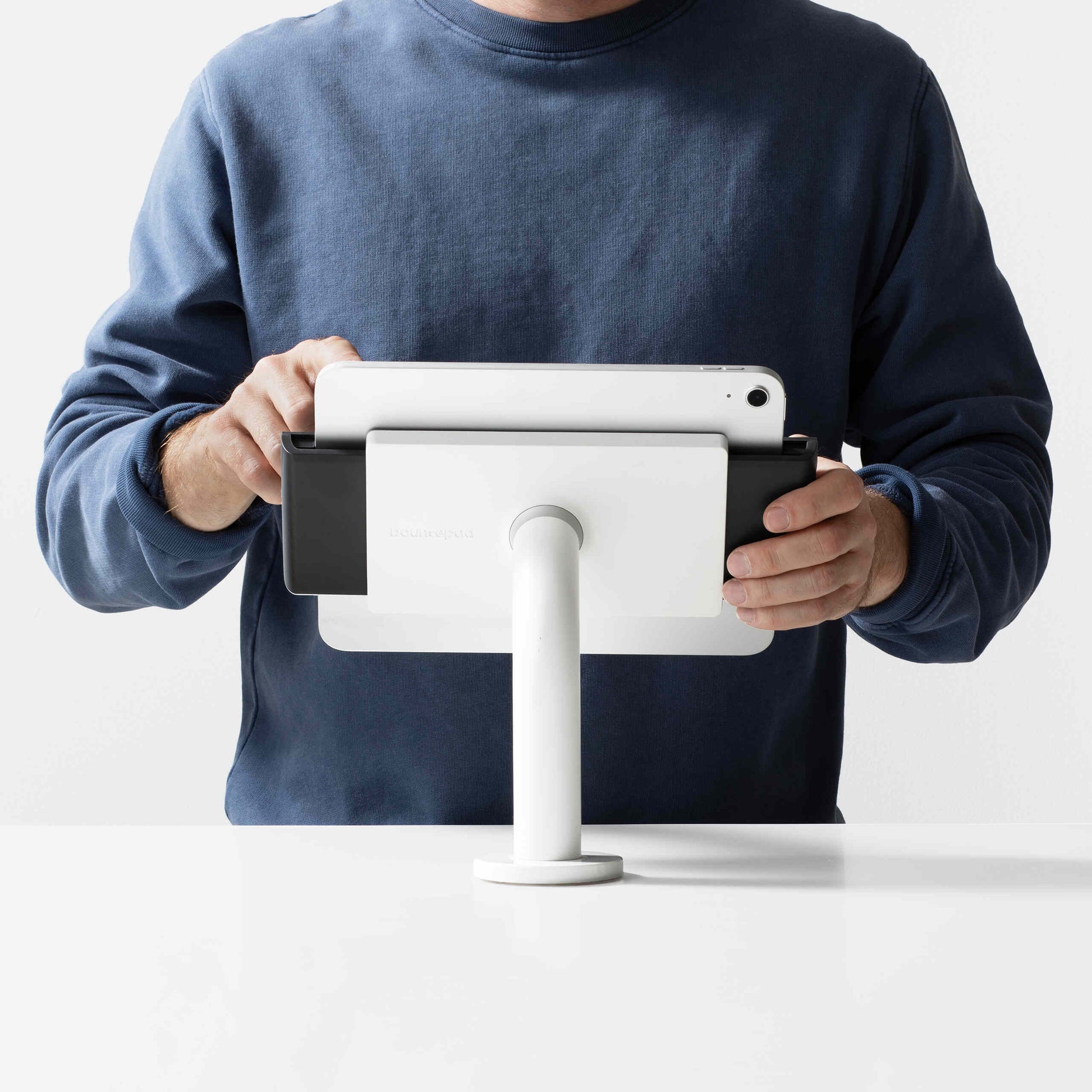 Bouncepad Clip Static 60 Tablet Desk Mount in white, shown in use