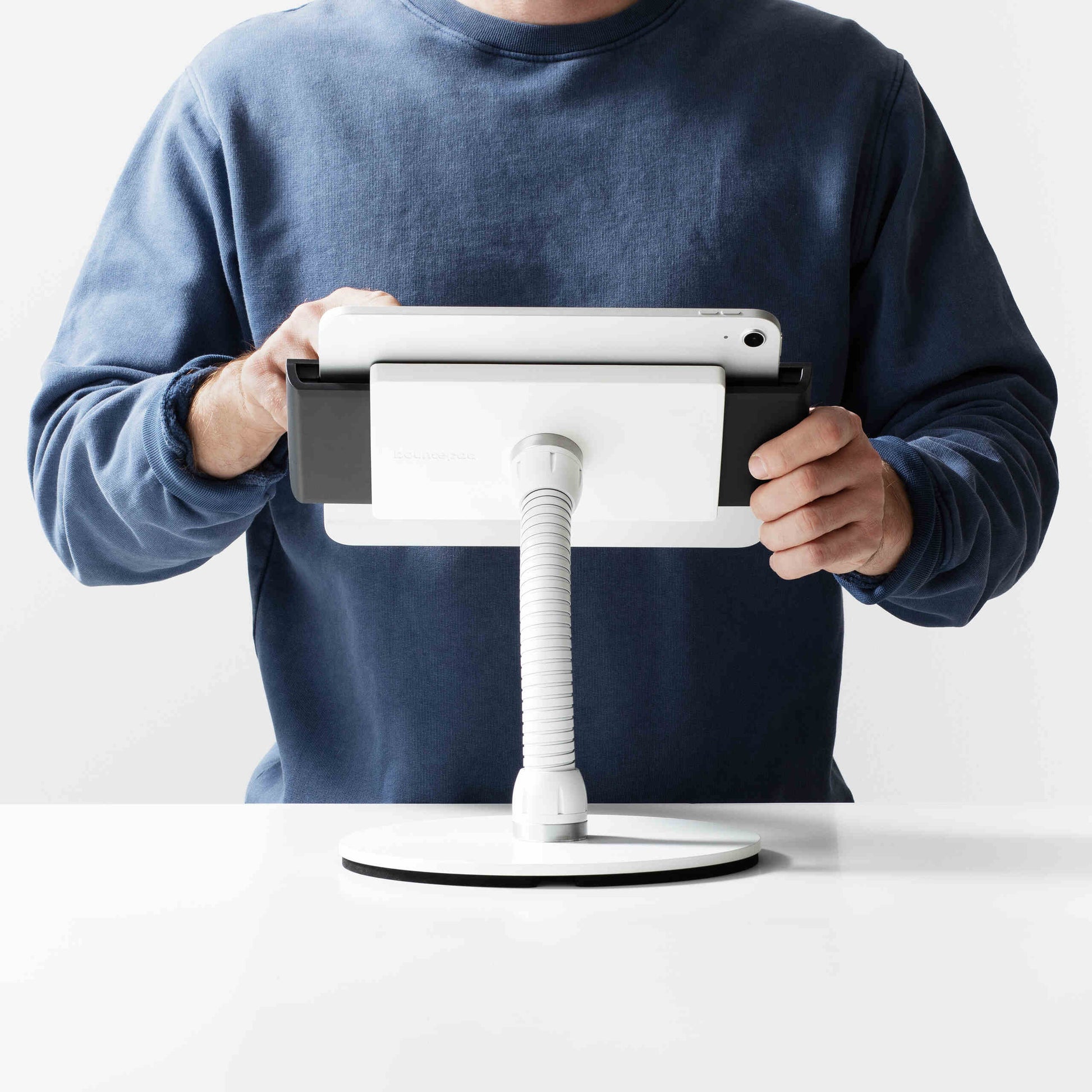 Bouncepad Clip Counter Flex Tablet Stand in white, shown in use