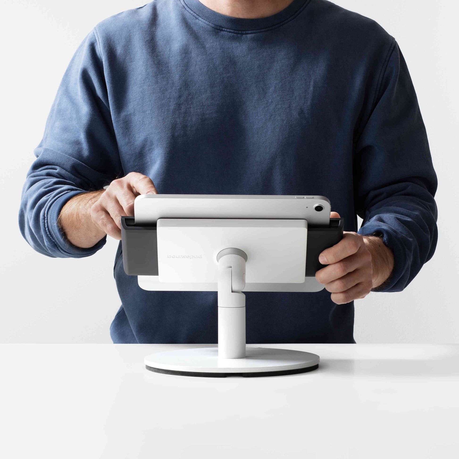 Bouncepad Clip Counter Twist-Mini Tablet Stand in white, front view, shown in use