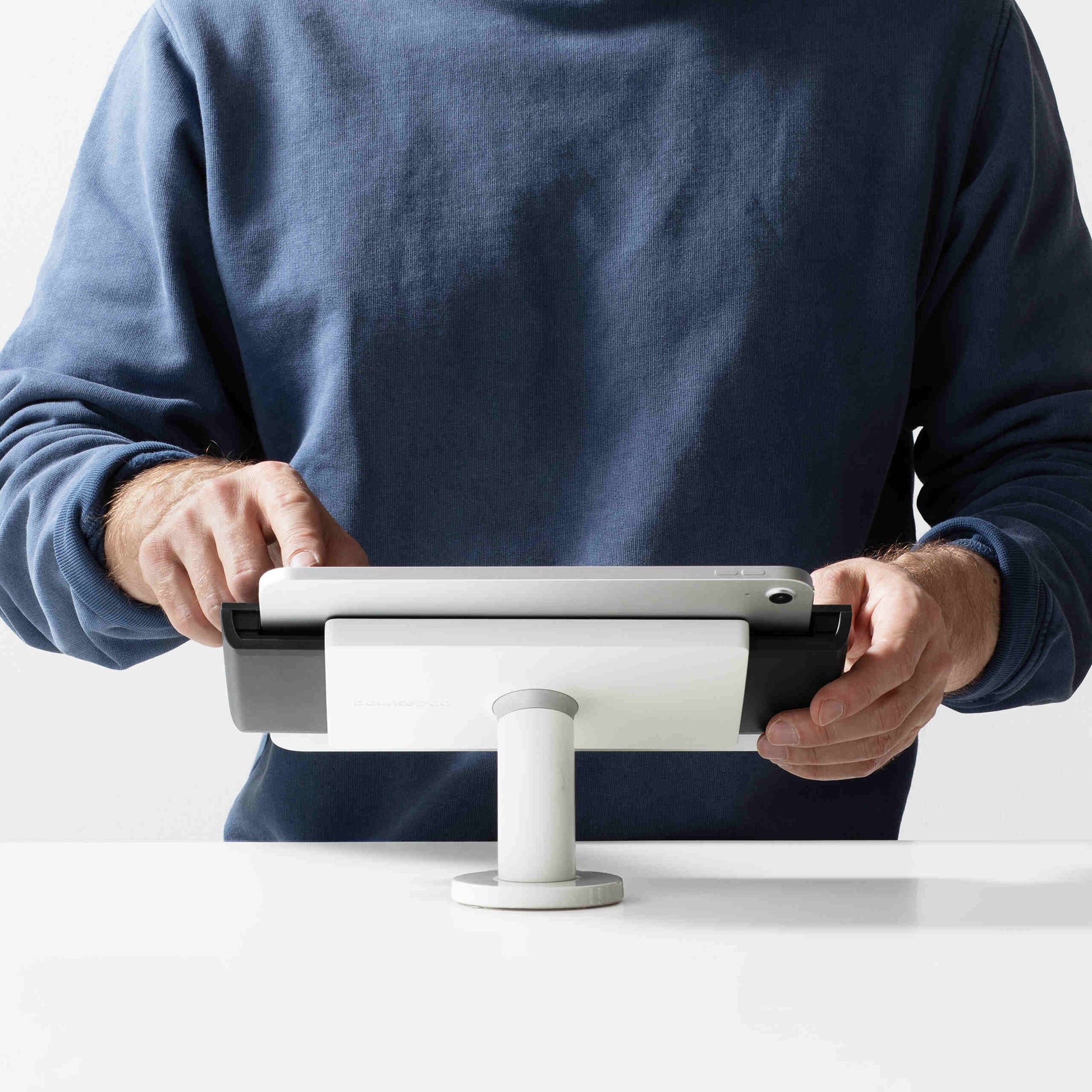 Bouncepad Clip Desk Tablet Desk Mount in white, shown in use
