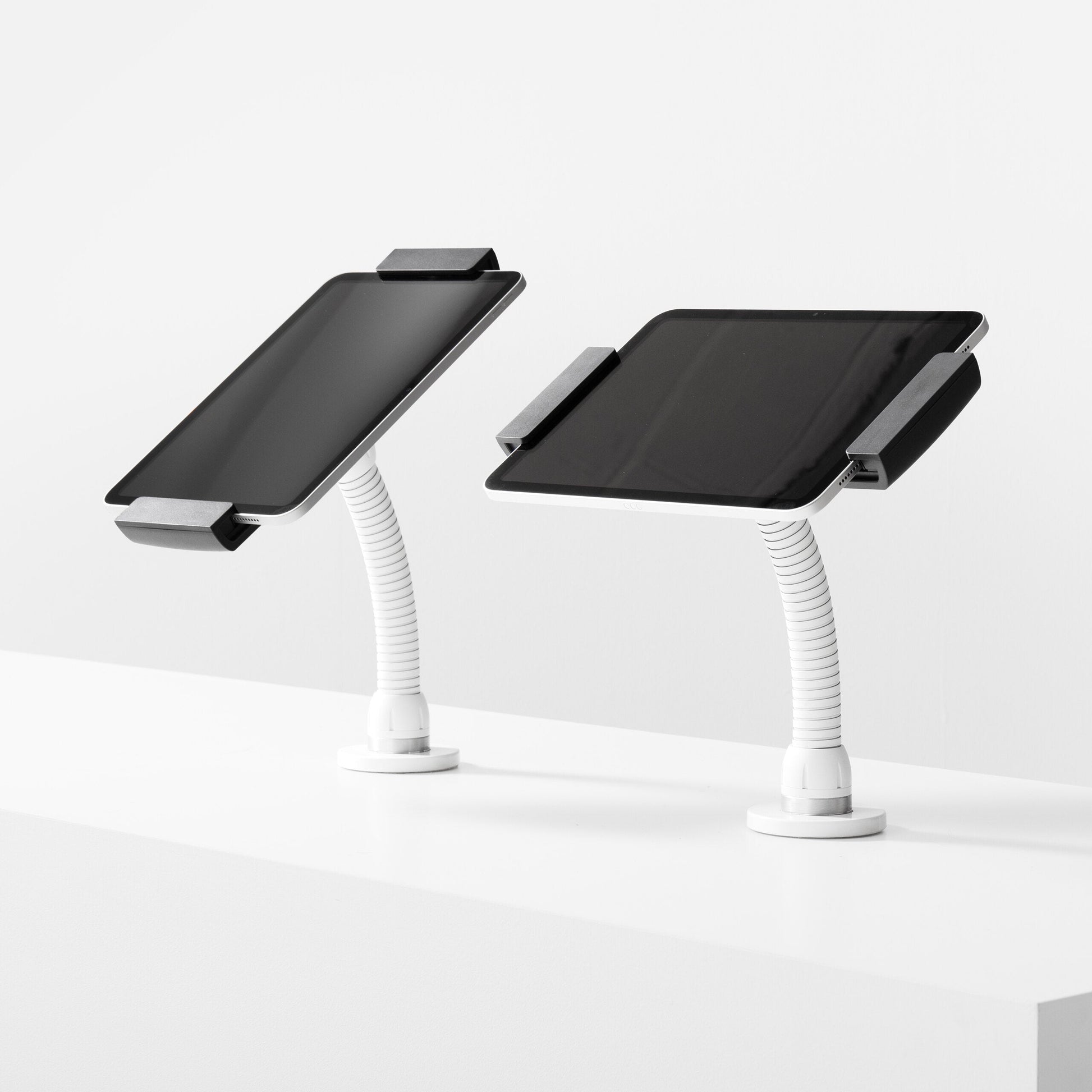Bouncepad Clip Flex Tablet Desk Mount in white, portrait and landscape orientation