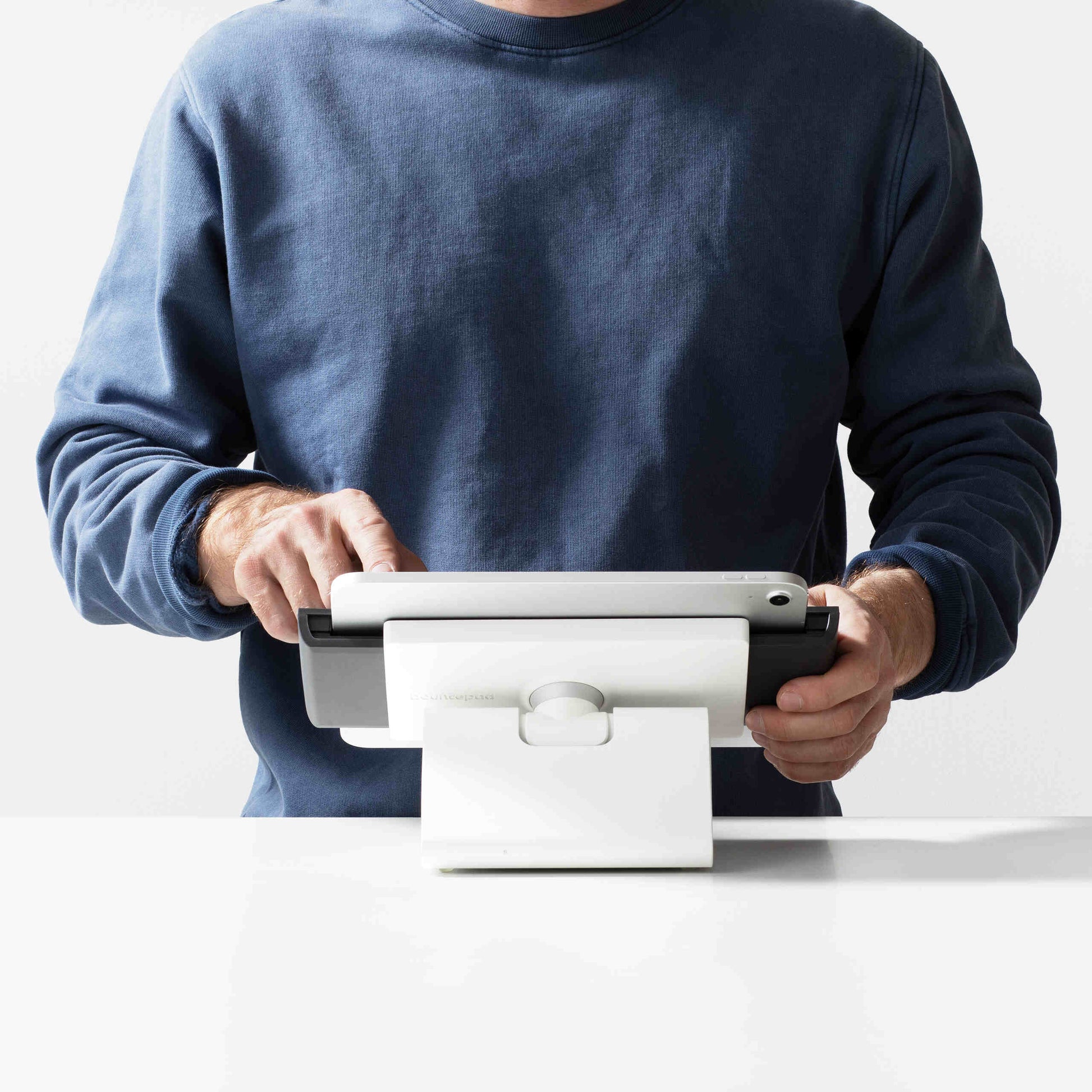 Bouncepad Clip Flip Tablet Stand in white, shown in use