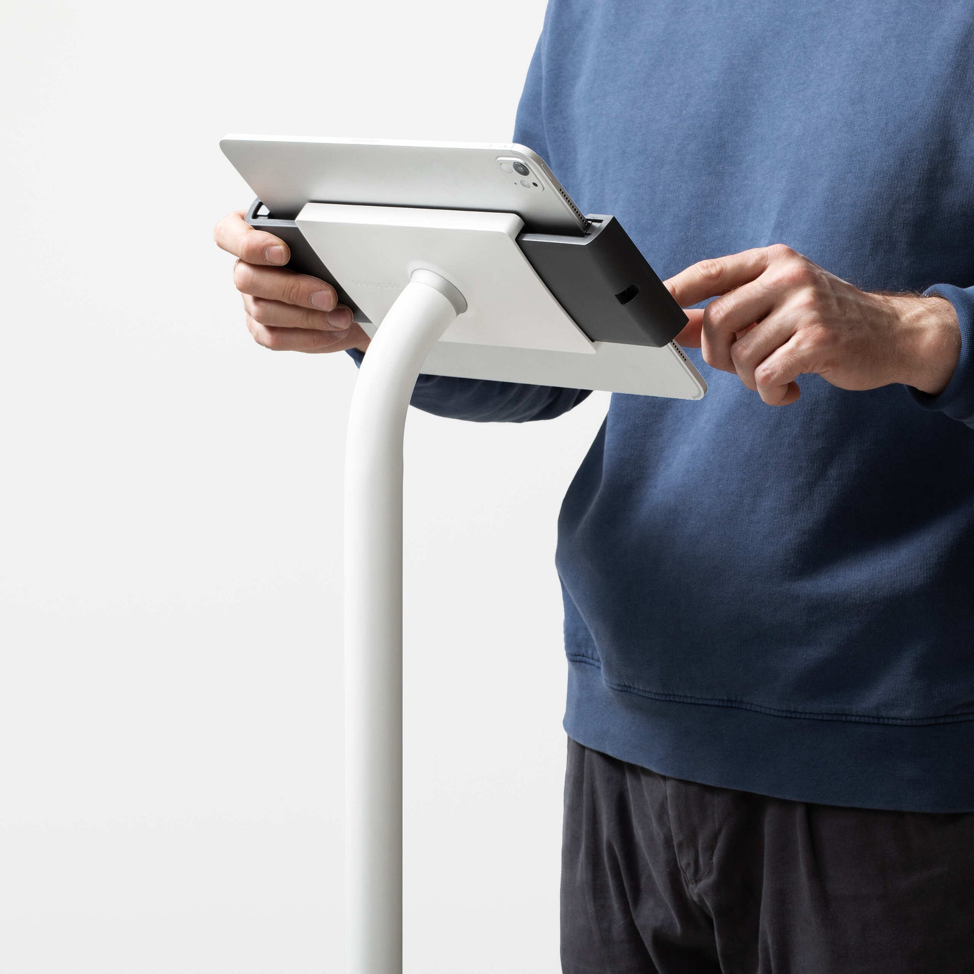 Bouncepad Clip Floorstanding Slim Tablet Floor Stand in white, shown in use