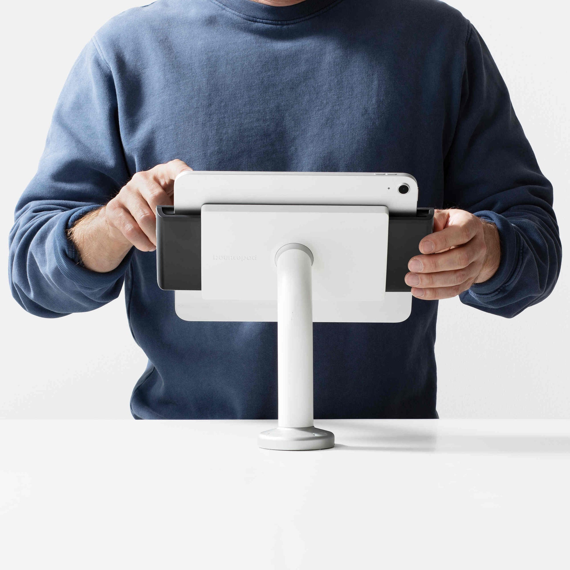 Bouncepad Clip Swivel 60 Tablet Desk Mount in white, shown in use