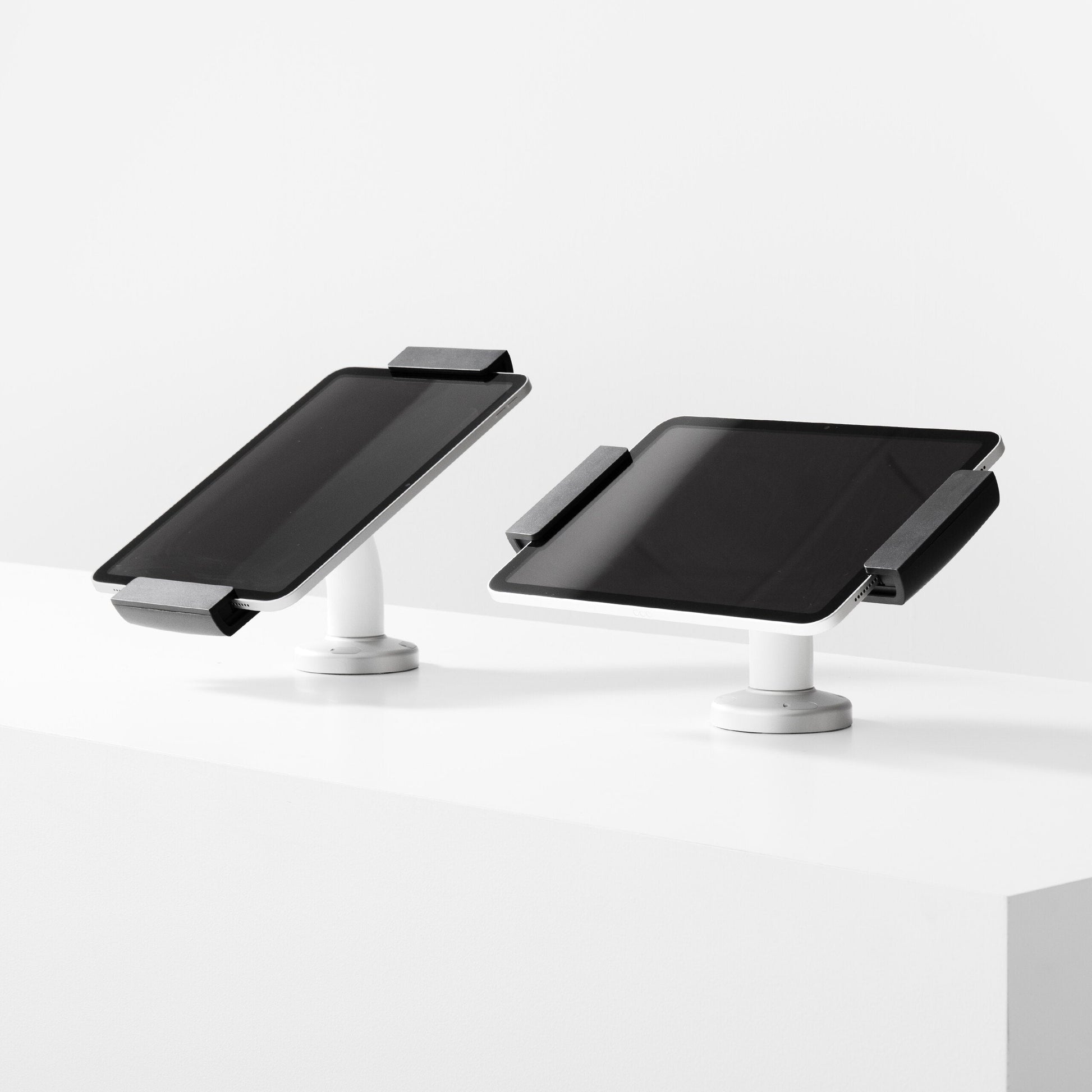 Bouncepad Clip Swivel Desk Tablet Desk Mount in white, portrait and landscape orientation