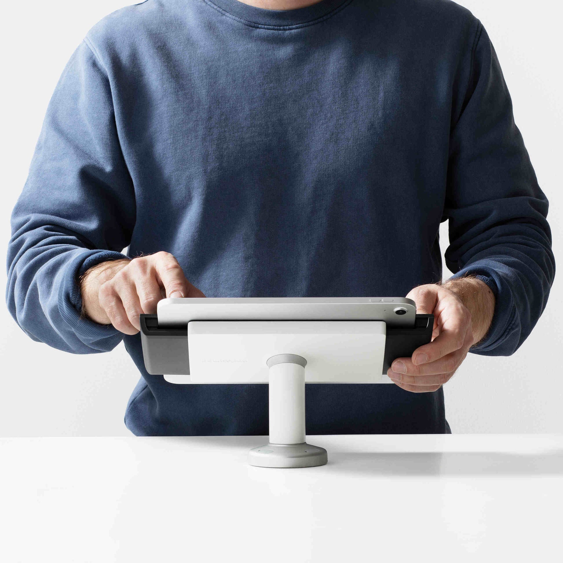 Bouncepad Clip Swivel Desk Tablet Desk Mount in white, shown in use