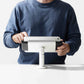 Bouncepad Clip Twist-Mini Tablet Desk Mount in white, front view, shown in use