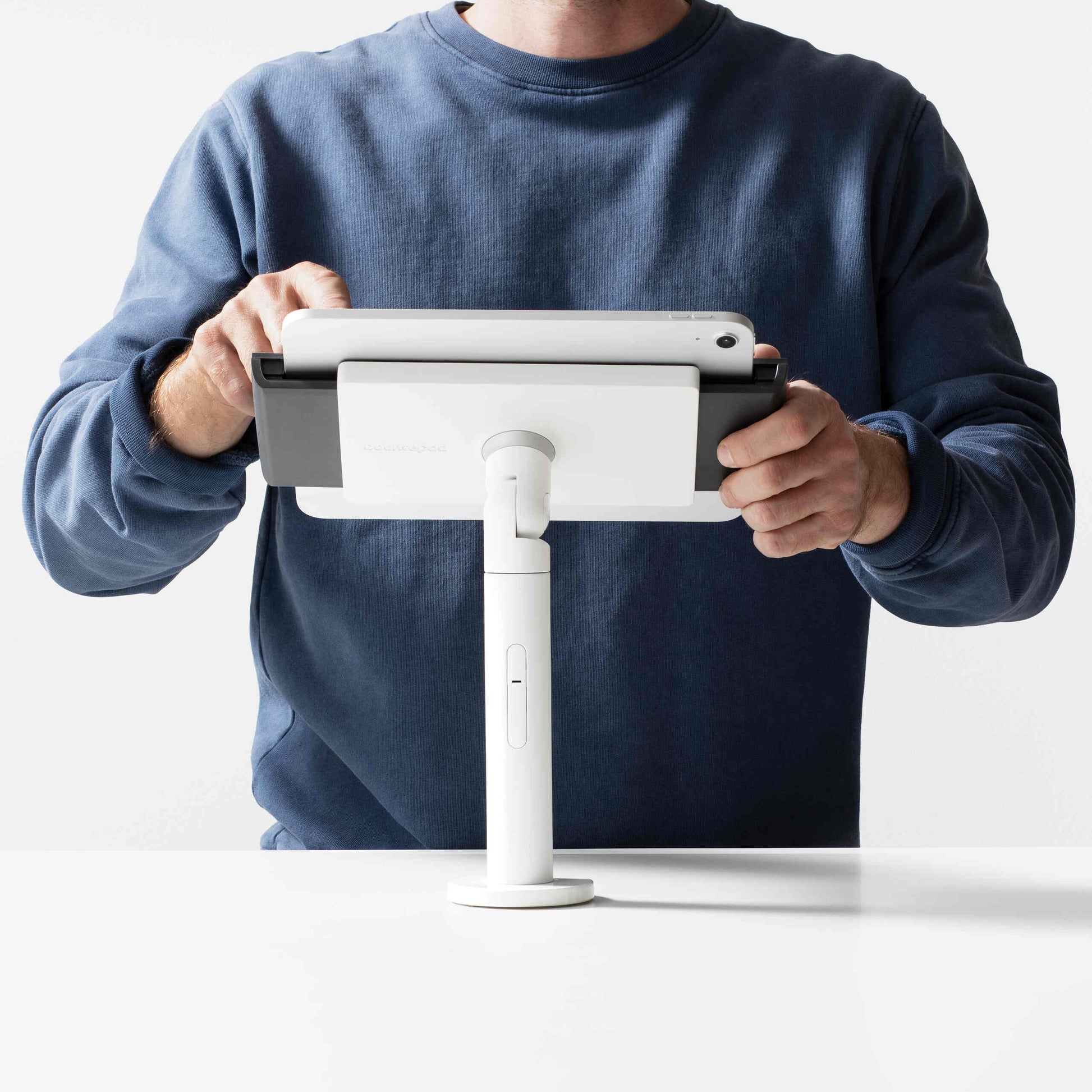 Bouncepad Clip Twist Tablet Desk Mount in white, front view, shown in use