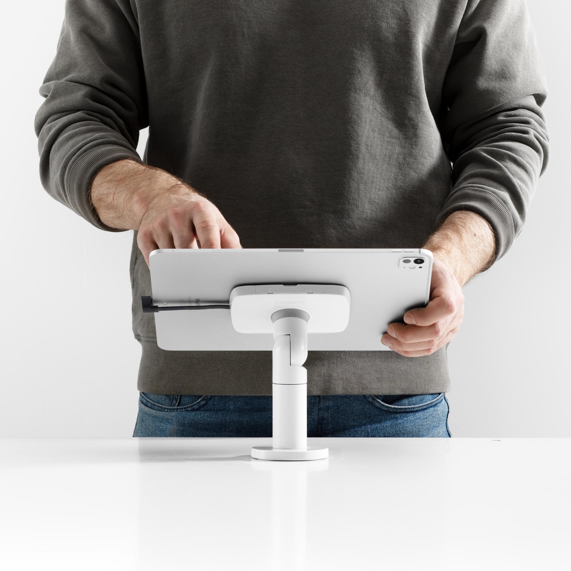Bouncepad Core Twist-Mini Tablet Desk Mount in white, shown in use