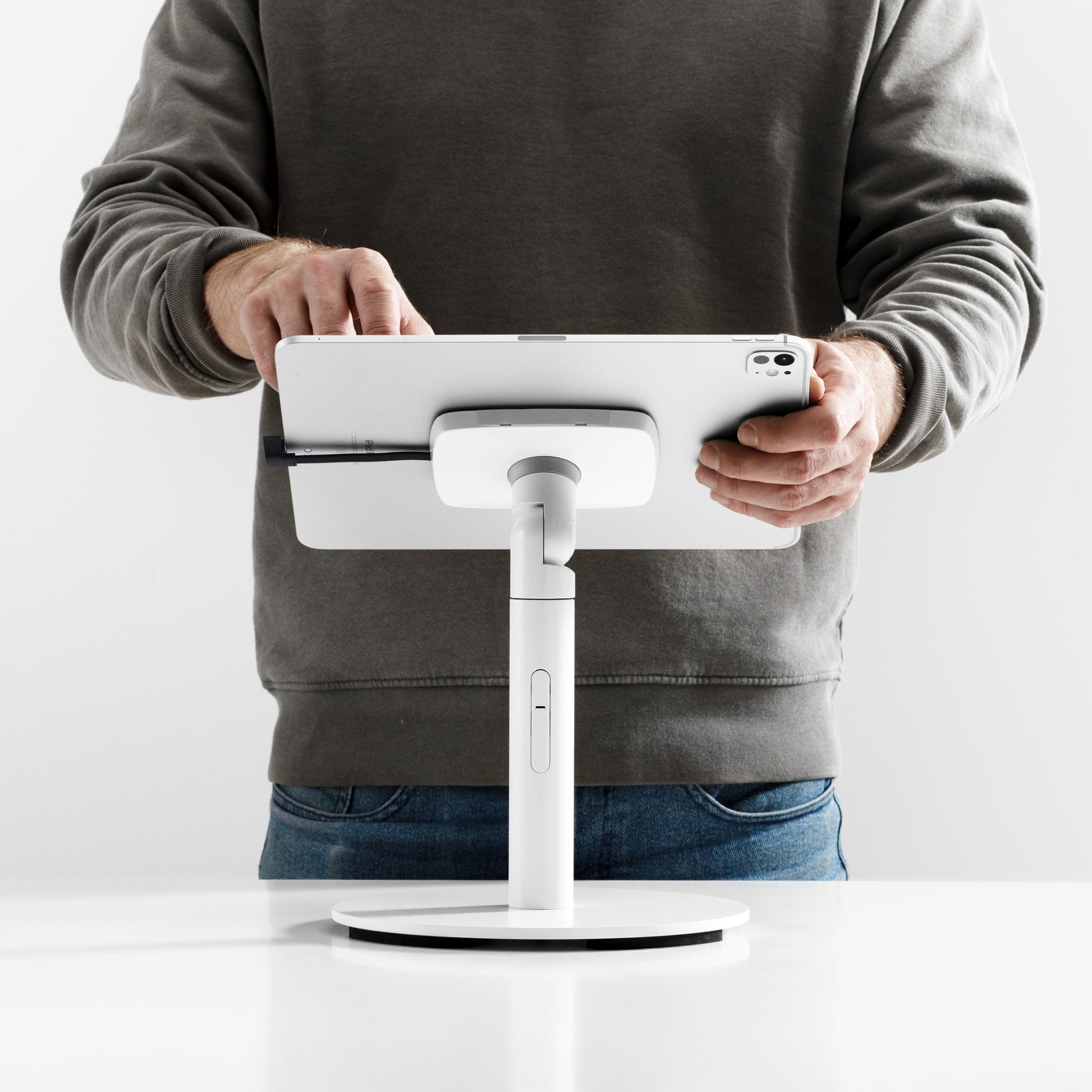 Bouncepad Core Counter Twist Tablet Stand in white, shown in use